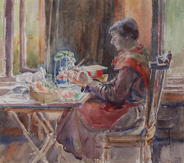 watercolour of a woman creating a model at a table