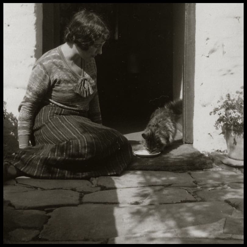 Mary Stella Edwards sat on doorstep with her cat