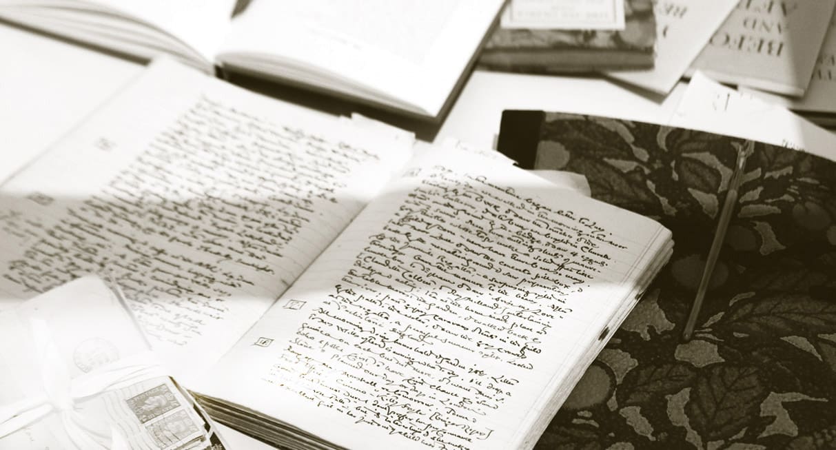 Photograph of a book of writing by Mary Stella Edwards on a desk